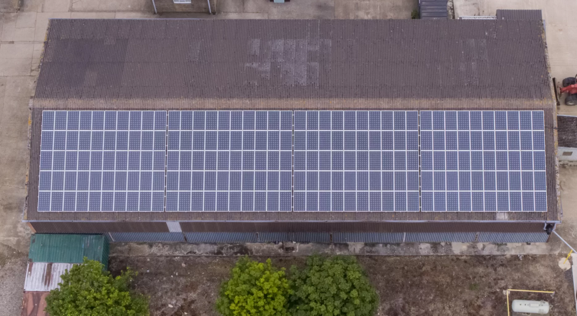 Solar panel inspections in West Sussex for insurance Domestic solar array packed around a chimney and vent stack on a pitched tiled roof