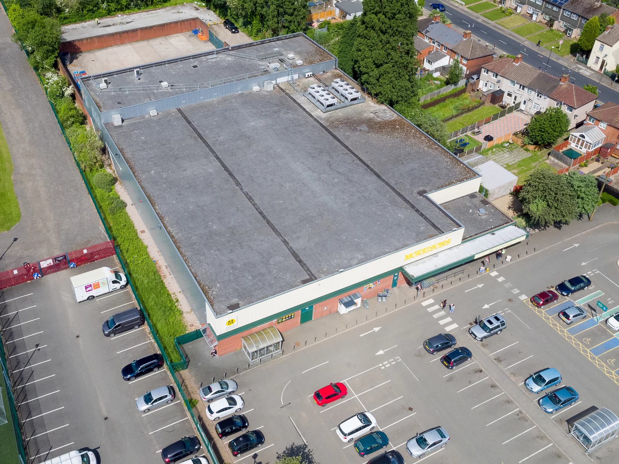 Commercial building portfolio roof surveying in Sussex Thermal image of a residential block elevation recorded from the air during a portfolio survey